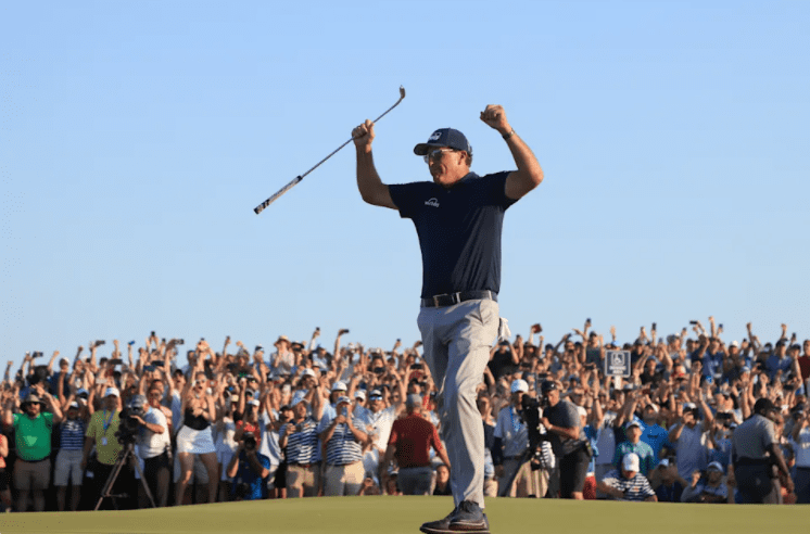 Cover Image of Phil Michelson with hands raised