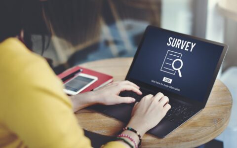 Woman on computer completing an after-purchase survey